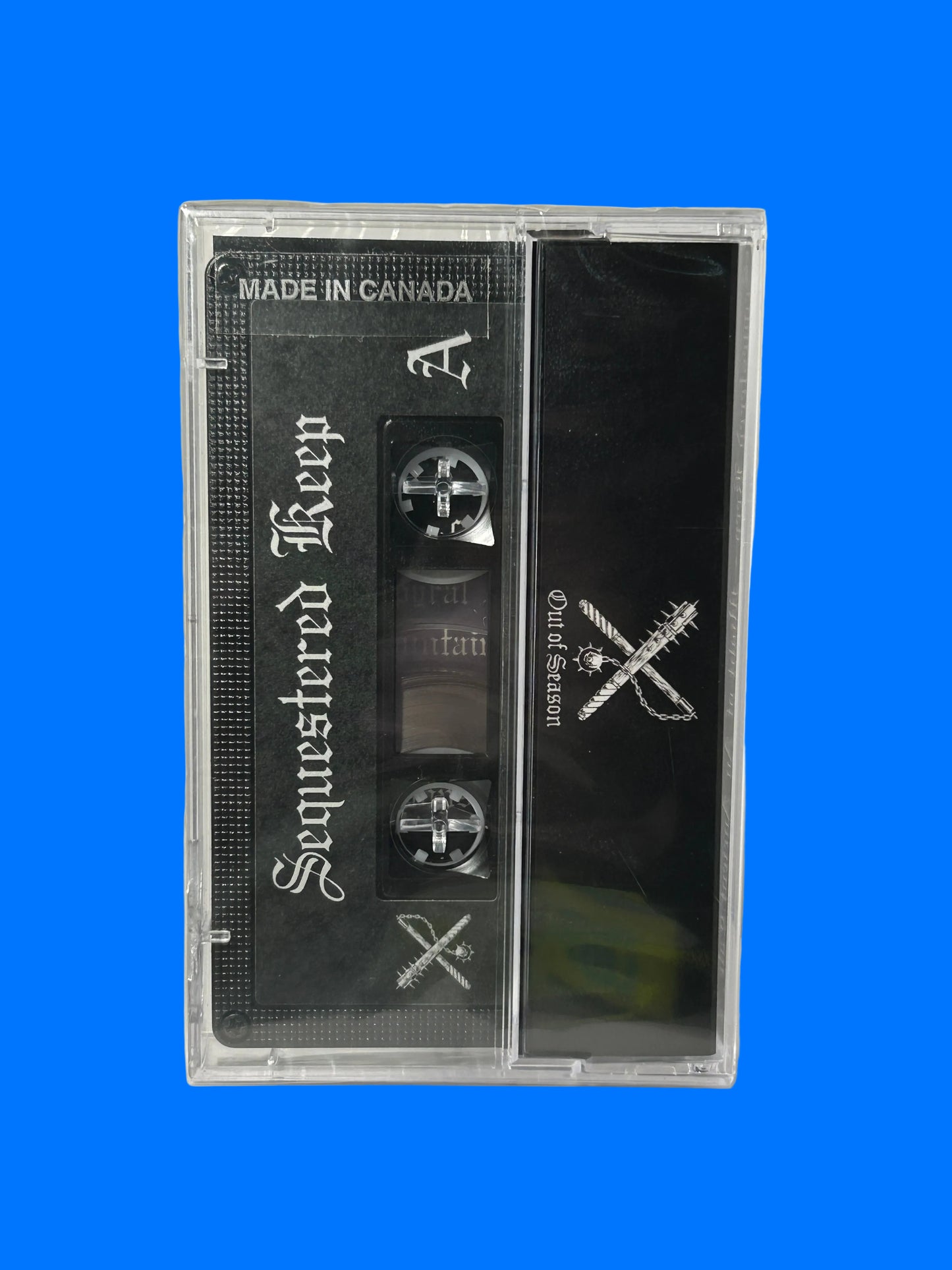 Cassette tape with black label featuring white text on a white background. sequestered keep