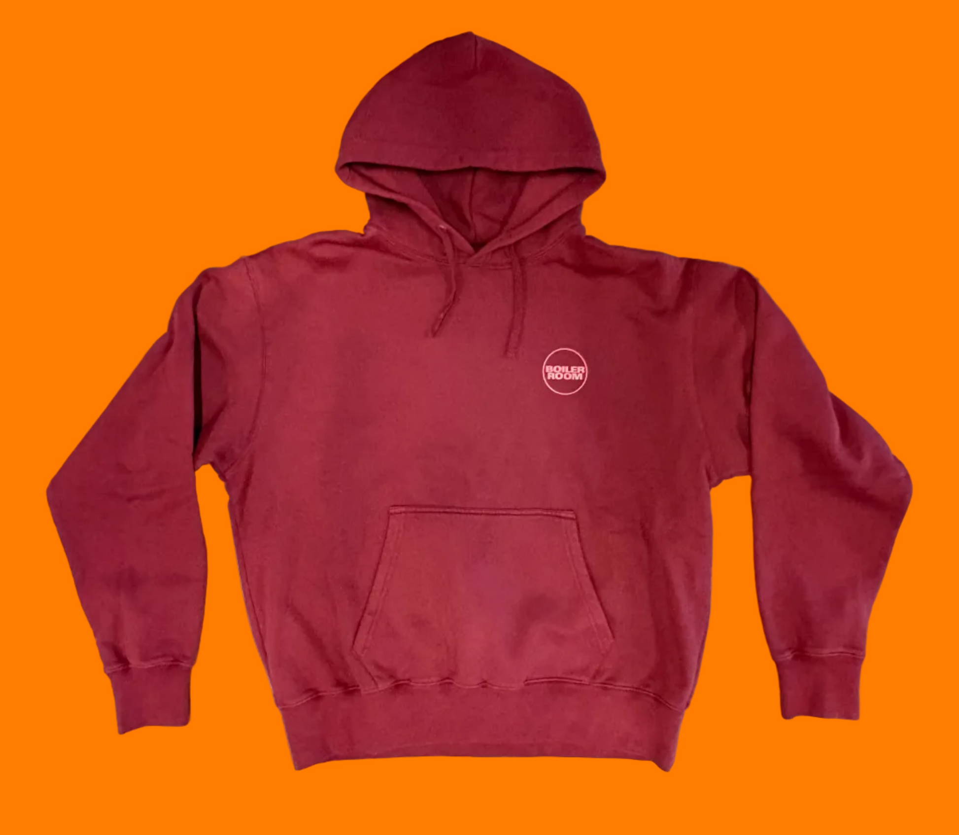 Brick red hoodie with bright red screen printed logo on the left chest.