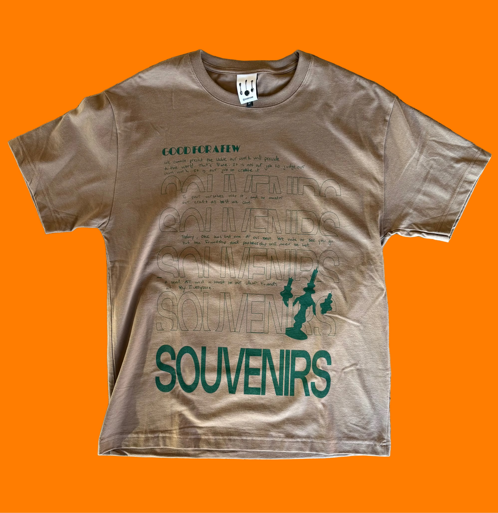Brown tee shirt with hunter green screen printed Souvenirs design by BY.Everyone.