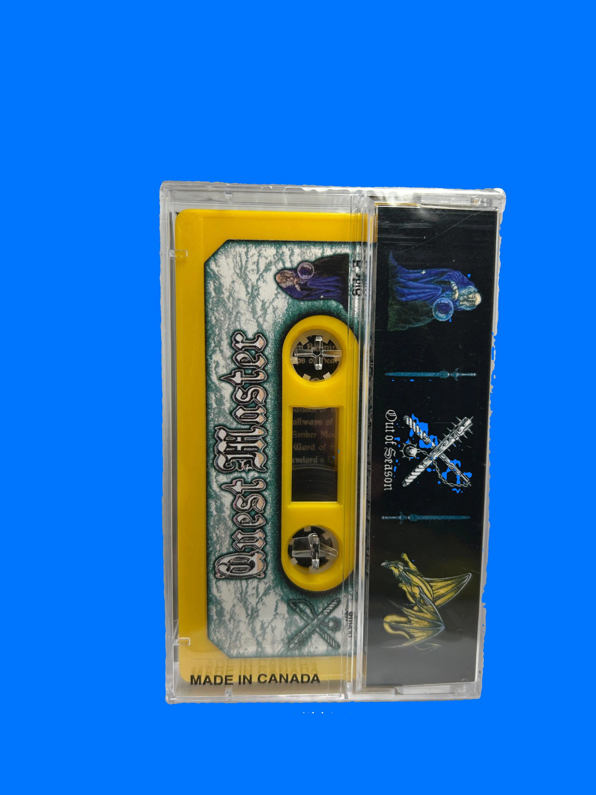 Cassette tape with a black and yellow label on a white background quest master