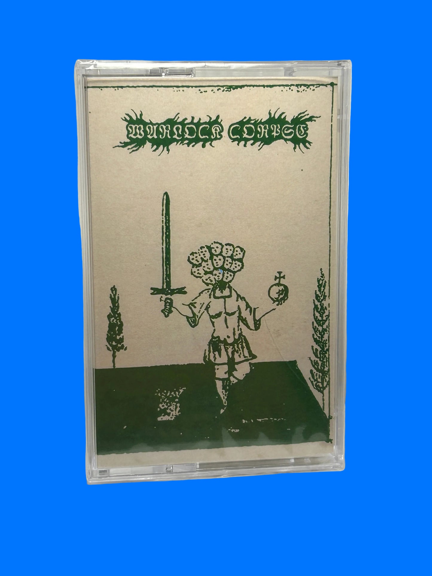 Cassette tape with a cover featuring a person holding a sword and plants on a white background Warlock Corpse