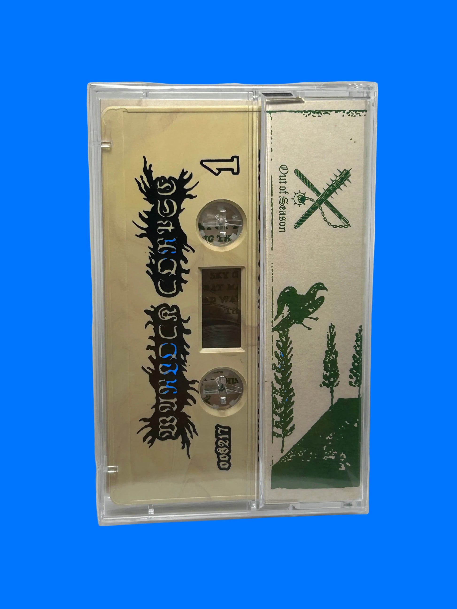 Cassette tape with green and black design on a white background warlock corpse