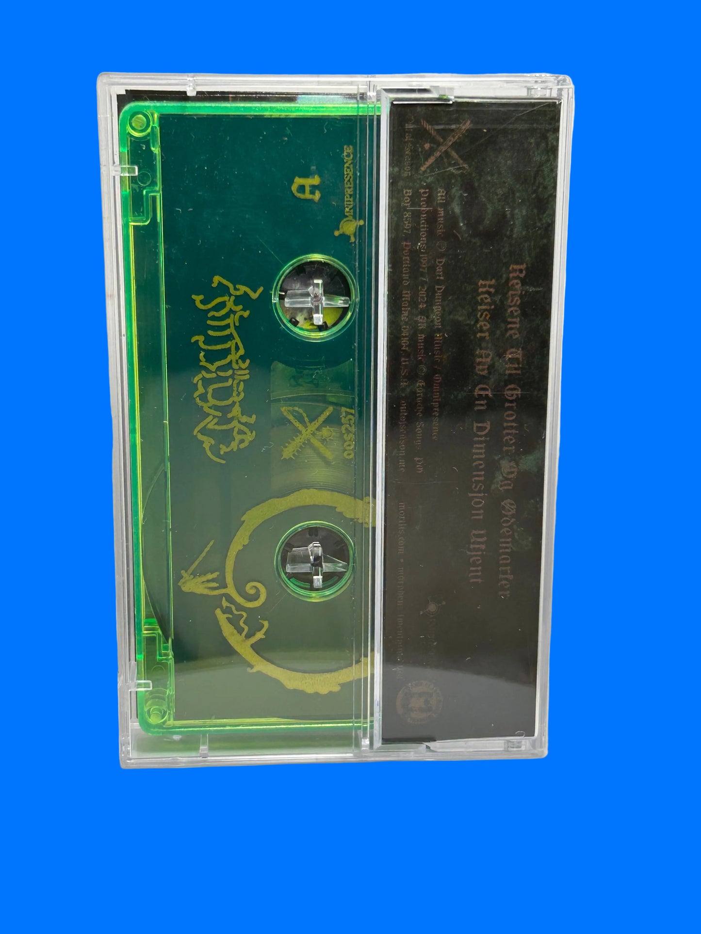 Green cassette tape with decorative cover on a white background mortiis