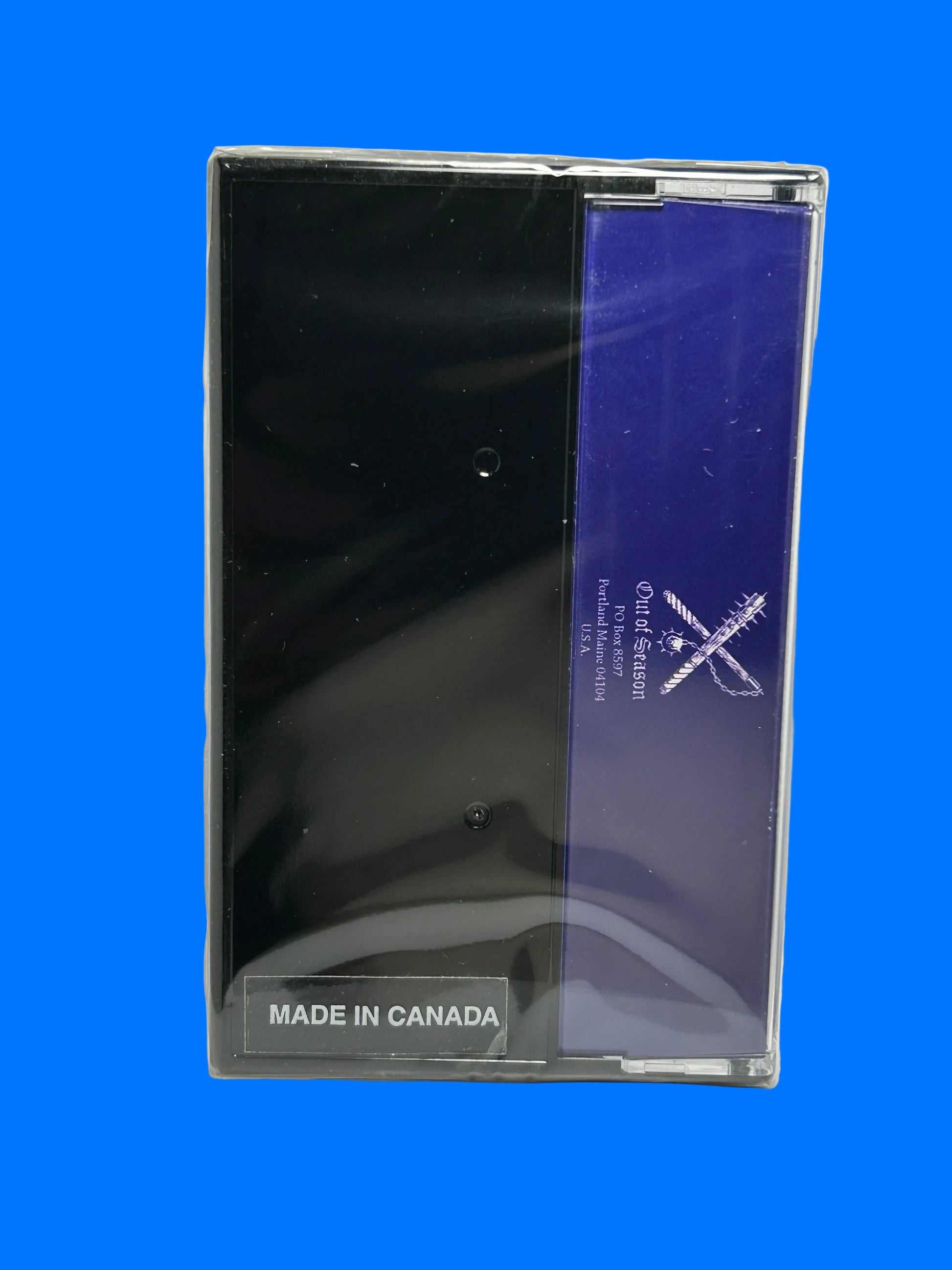 cassette case with blue label and 'Made in Canada' text on a white background mystic towers