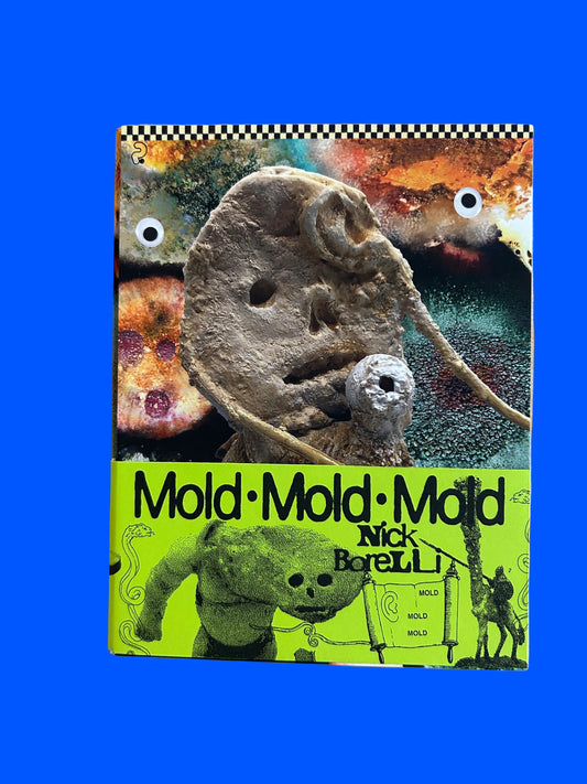 Book titled 'Mold' by Nick Borelli on a wooden surface