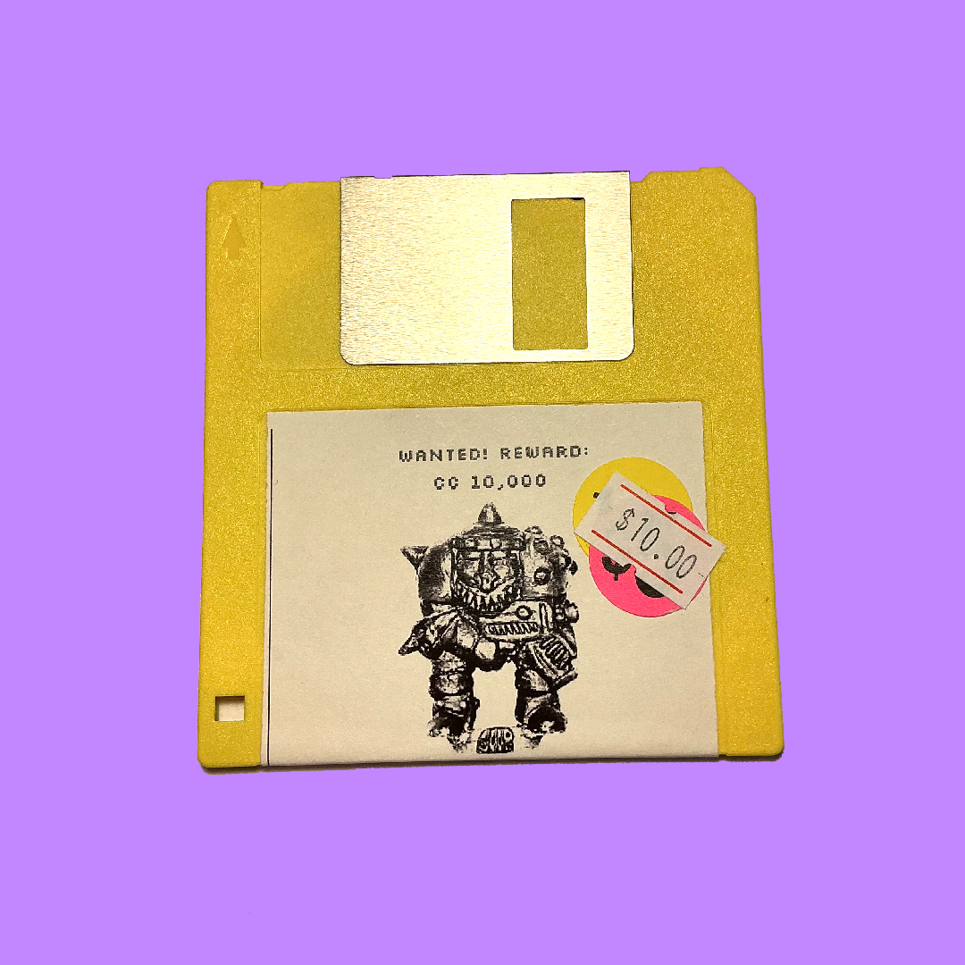 A vintage yellow 3.5-inch floppy disk with a white label featuring a black robot illustration and text reading 'WANTED! REWARD: CO 10,000' and a pink price sticker showing '$10.