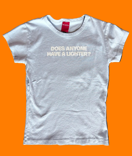 BY.Everyone light blue baby tee with the words "Does Anyone Have A Lighter?" printed on the center chest in white.