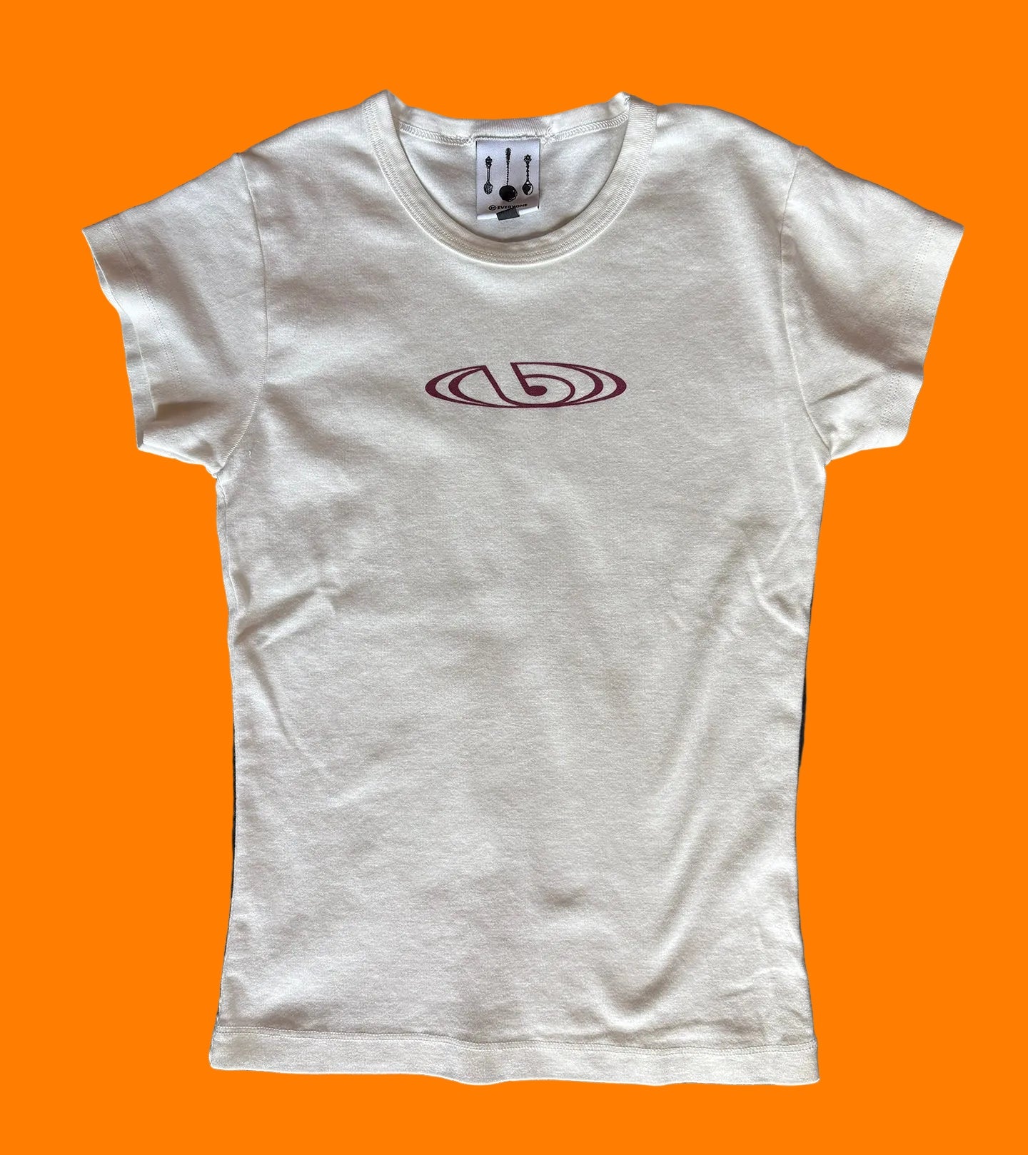 BY.Everyone Cream Baby Tee with burgundy logo printed on the center chest.